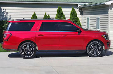 A red car with tinted windows