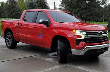 A red truck with tinted windows