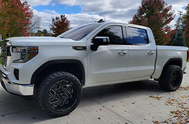 A white truck with tinted windows