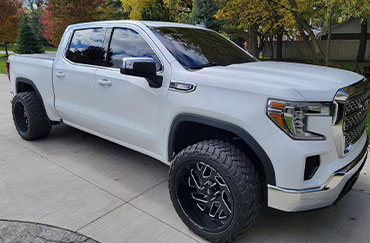 A white truck with tinted windows